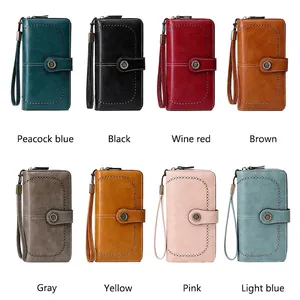 RFID blocking long leather wallets for women in eight colors with floral punch decoration