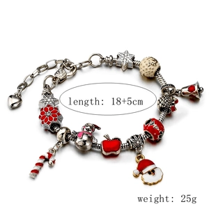 Silver Christmas charm bracelet with snowman, Santa, and candy cane pendants, 18+5cm