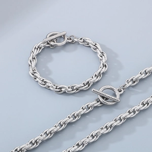 Detailed shot of silver titanium steel rope chain set with OT toggle clasp and skull design