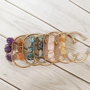 Adjustable gold cuff bracelets with raw crystals like amethyst and quartz in wire wrap style