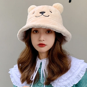 Plush bear ear bucket hat in beige featuring cute facial embroidery and warm fur texture