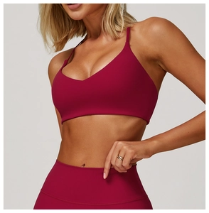 Detailed close-up of wine red brushed yoga bra and high waist leggings sport set