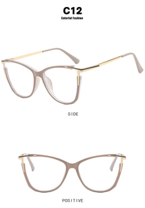 Detail view of cat-eye glasses frames with beige acetate front and gold metal temples