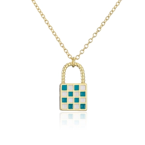 Detail view of gold locket pendant with blue and white checkerboard enamel design