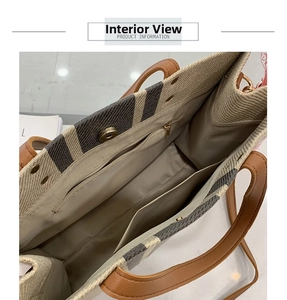 Detailed interior view of striped canvas tote bag showing zipper pocket and magnetic closure