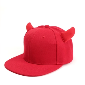 Detailed view of red devil horn design on flat brim hip hop baseball cap made of cotton