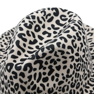 Detailed close-up of cream leopard print wool fedora showing texture and pattern