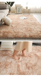 Detail of plush beige camel shag rug showing soft texture and cozy living room layout