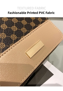 Close-up of patterned PVC fabric with beige faux leather and gold metal plate detail