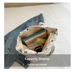 Top view of large beige tote bag interior showing space for tablet, umbrella and wallet