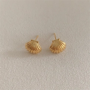 Minimalist gold shell stud earrings made of 925 sterling silver with textured stripes