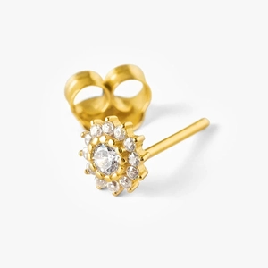 Macro shot of gold floral stud earring featuring white zircon pavé and micro-prong setting