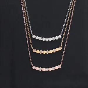 Minimalist hexagonal bangles with micro-pave cubic zirconia in gold, silver, and rose gold