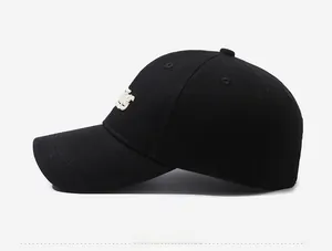 Side view of black cotton baseball cap with white 3D embroidery and six-panel crown