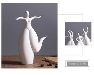 Close-up detail of white ceramic abstract girl sculpture with smooth matte finish