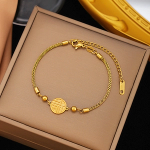 Gold stainless steel bracelet with Fu character pendant and beads in a jewelry box