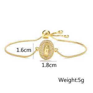 Macro view of adjustable gold Virgin Mary bracelet with inlaid cubic zirconia detailing