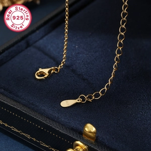 Detail of S925 sterling silver lobster clasp and adjustable chain on gold necklace