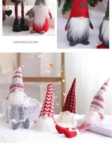 Detailed close-up of handmade Christmas gnome ornaments with red and grey fabric patterns