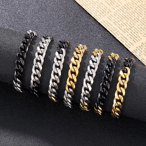 Variety of Cuban link bracelets for men in black, silver, and gold stainless steel finish