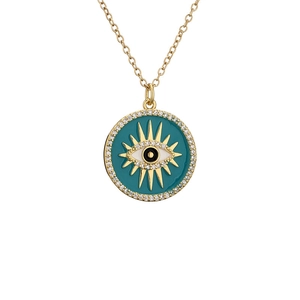 Gold evil eye pendant necklace with micro-pave crystals and blue enamel on white background