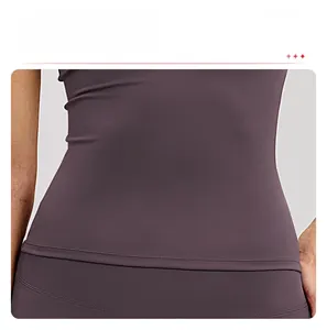 Detail of high-density elastic fabric with tight stitching on a deep purple fitness top