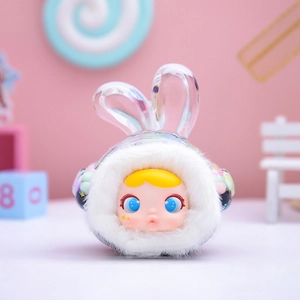 Detailed view of plush doll with blue eyes and yellow hair in a candy land setting