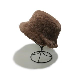Close-up of the thick brown faux mink fur texture on a warm winter bucket hat