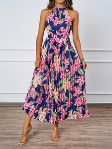 Detailed view of elegant navy floral halter dress with pleated skirt and matching waist tie