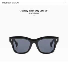 Front close-up of black square sunglasses with silver stud rivets and grey lenses