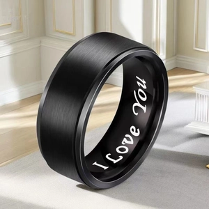 Close-up of black brushed stainless steel ring with inner I Love You engraving