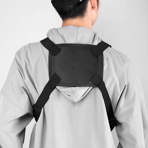 Rear view of black tactical vest chest bag with adjustable straps and velcro panel