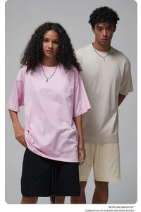 Detail of drop-shoulder cotton oversized t-shirt and shorts set in pastel colors