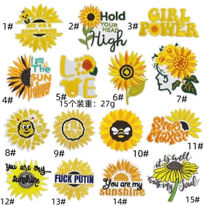 Close-up of assorted sunflower and character embroidery patches for clothing and bags