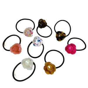 Set of eight sweet camellia flower hair ties in resin finish for high ponytails
