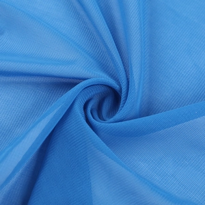 Macro detail of royal blue sheer mesh fabric showing breathable knit texture and transparency