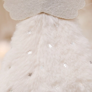Close-up of white plush Christmas ornament with silver star sequins and felt details