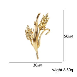 Elegant gold wheat ear brooch with yellow crystals and size dimensions display