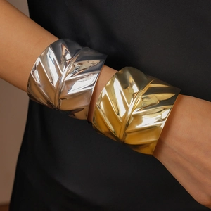 Metallic geometric leaf-textured open cuff bracelets in polished gold and silver finishes