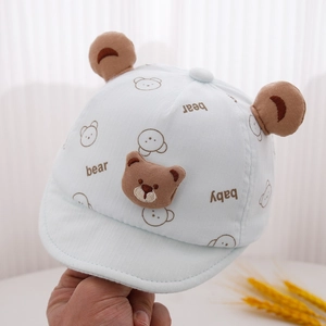 Detail of light blue baby sun hat with cute bear ears and bear embroidery