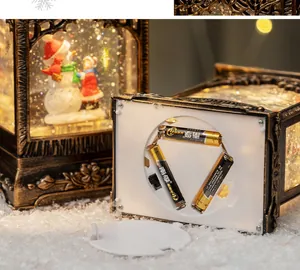 Detail view of the bottom compartment showing battery slot and switch for Christmas snow globe