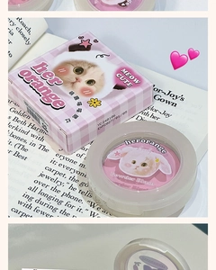 Detail of powder blush in cat-themed packaging with cute illustration and soft pink shade