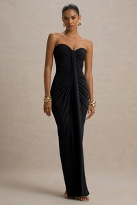 Detailed close-up of the elegant ruched draping on the black strapless evening gown