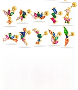 Détails de clous d'oreilles en zircon coloré, formes de papillon et fleurs