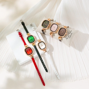 Fashionable women's oval quartz watches with diamond bezels and colorful leather straps