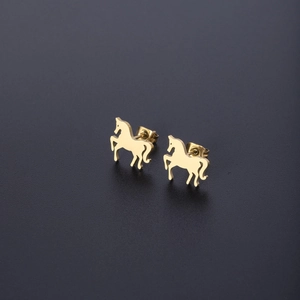 Detailed close-up of gold-plated pony stud earrings with a glossy metallic finish