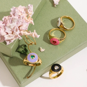 Luxurious gold stainless steel heart rings with colorful enamel and sparkling center stones