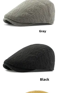 Vertical display of knitted newsboy caps in gray, black, and ginger yellow colors