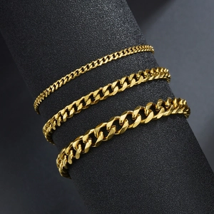 Three varying widths of 18k gold-plated titanium steel Cuban link bracelets for men