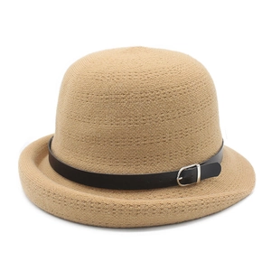 Detail of the woven texture and black decorative strap with silver buckle on a cloche hat